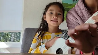 Zoe playing ukulele