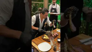 Golden steak Nusret, Istanbul. Salt Bae show with beef.