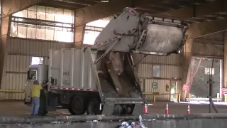Garbage Trucks Unloading
