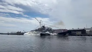 USS Cleveland LCS douses tugboat during last-ever side launch at Wisconsin shipyard