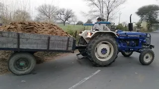 Farmtrac 41 speed on road with trolley