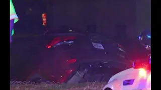 Car left hanging on embankment after crash in downtown Houston, police say