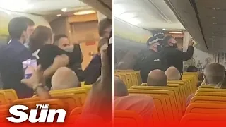 Cops storm Ryanair flight after fighting passengers went 'hell for leather'