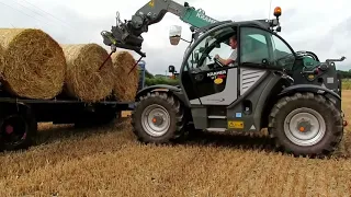James loading round bales of straw with the new Kramer KT356