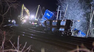 Crews working to remove derailed Mass. railcars