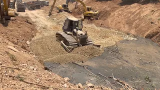 Working Teams Dump Truck Unloading Stone Heavy Duty Machinery Excavator Clearing Deep Mud Canal