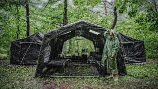 Solo camping in a cozy inflatable tent deep in the mountains during heavy rain