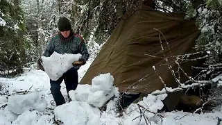 55 Days Build a bushcraft shelter using large blocks of ice and snow to shelter overnight alone