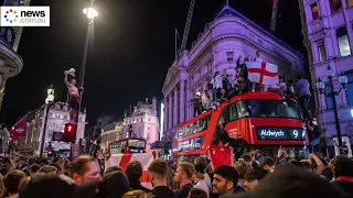 Fans celebrate England win in London's Leicester Square