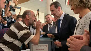 Syrian President Bashar al-Assad and his wife Asma cast their votes in war-torn Douma | AFP