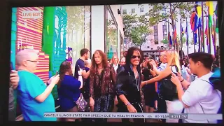 Steven Tyler shoves douche bag out-of-the-way.