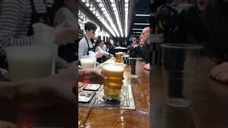 Fast-pouring beer technology at Tottenham’s new stadium - filling through the bottom of the cup