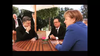 Меркель заставила Порошенко и Путина пожать руки
