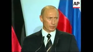 Comment from Merkel, Putin on NKorea, Politkovskaya murder