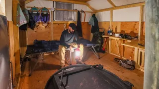 Cabin hot tent in canvas tent with old wood stove