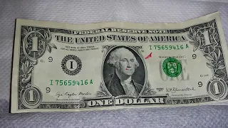 1977 one dollar bill thats is printed close to the bottom