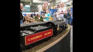 Huge Canadian Model Powered Steam Train passing by in, Huge Train Show. Edmonton Ab