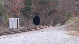 Train passing through tight tunnel hits wall. Scary tunnel