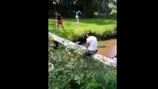 Guy Falls On A Tree Log Taking A Nut Shot While Crossing The River On His Bike