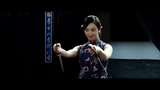 Sexy 李博 Li Bo in cheongsam kicks with long legs in "The Final Master", but gets knocked unconscious!