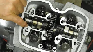 reassembly of a Honda 125 twin piston engine, cylinder, cylinder head, rocker arms, with settings