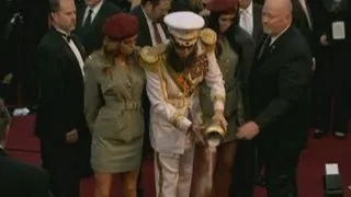 Oscars: Sacha Baron Cohen's General Aladeen pours 'Kim Jong-il's ashes on to the red carpet'!