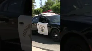 “Turn Right” CHP using PA system on traffic stop.