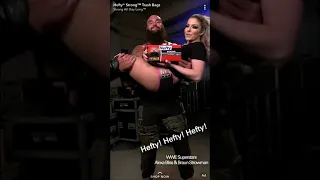 Braun Strowman gives Alexa Bliss a lift.