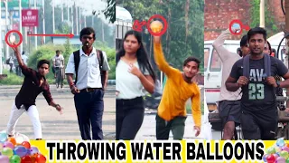 Throwing ice water balloons prank at people | water balloons prank | Kalkatia pranks