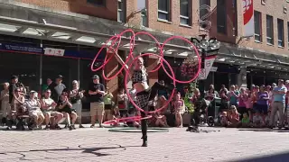 Busker Satya Bella;  perform hula-hoop tricks