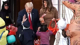 Trump hands out sweets and high fives at White House Halloween event