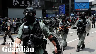 Hong Kong crisis: protesters and police clash over new anthem law