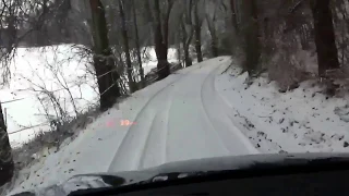 BMW X6 driving uphill in snow