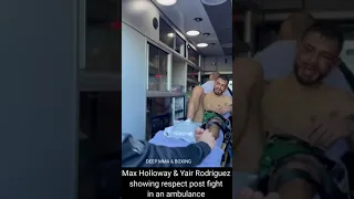 Max Holloway & Yair Rodriguez showing respect post fight in an ambulance