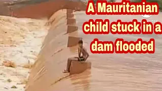 A Mauritanian child stuck in a dam flooded