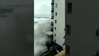 Watch as this huge wave rips right through some hotel balcony’s in Tenerife 😱