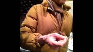 Magician Uri Geller bending a spoon in London