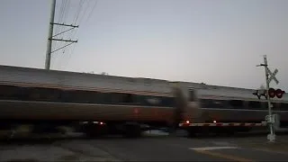 Amtrak Train Goes Through Crossing On Old Clickety Clack Track