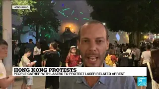 Hong Kong: people gather with lasers to protest laser-related arrest