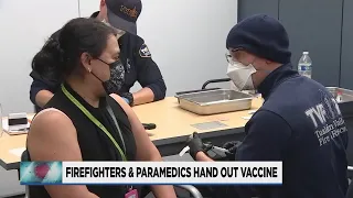 EMT's, paramedics help give out COVID-19 vaccines