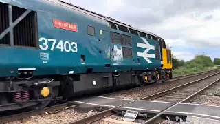 37403 leads The East Anglian Explorer past Strayground Lane 19/07/2023