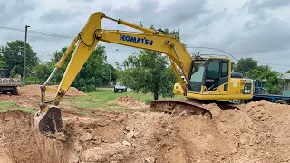 KOMATSU PC200-8 digging a fish pond