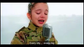 9 years old Ukrainian girl sing a song for peace..