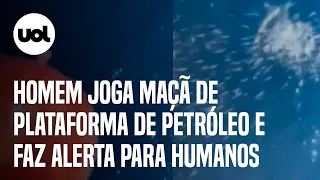 Homem joga maçã de plataforma de petróleo e diz que isso pode acontecer com humanos caso caiam