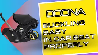 Buckling Baby in Doona Infant Car Seat