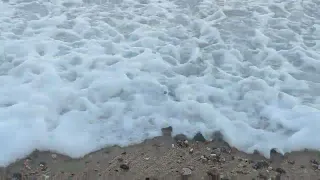 Ocean waves rolling gently over gravel creating magical sound