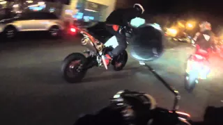 crazy riders do wheelies in San Francisco