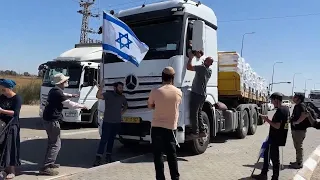 Protesters attempt to block humanitarian aid passing into Israel's Kerem Shalom crossing