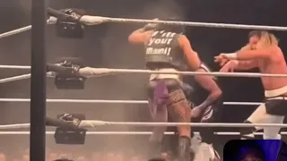 Rhea Ripley takes down dominik mysterio with a DDT at WWE live event with the help of seth rollins
