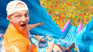 BIGGEST Backyard Water Slide With 100 MILLION ORBEEZ!